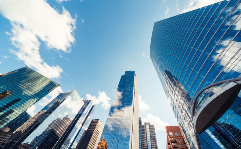Modern,Tower,Buildings,Or,Skyscrapers,In,Financial,District,With,Cloud