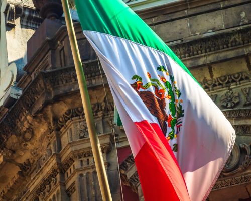 Mexican,Flag,On,Building,In,Mexico,City